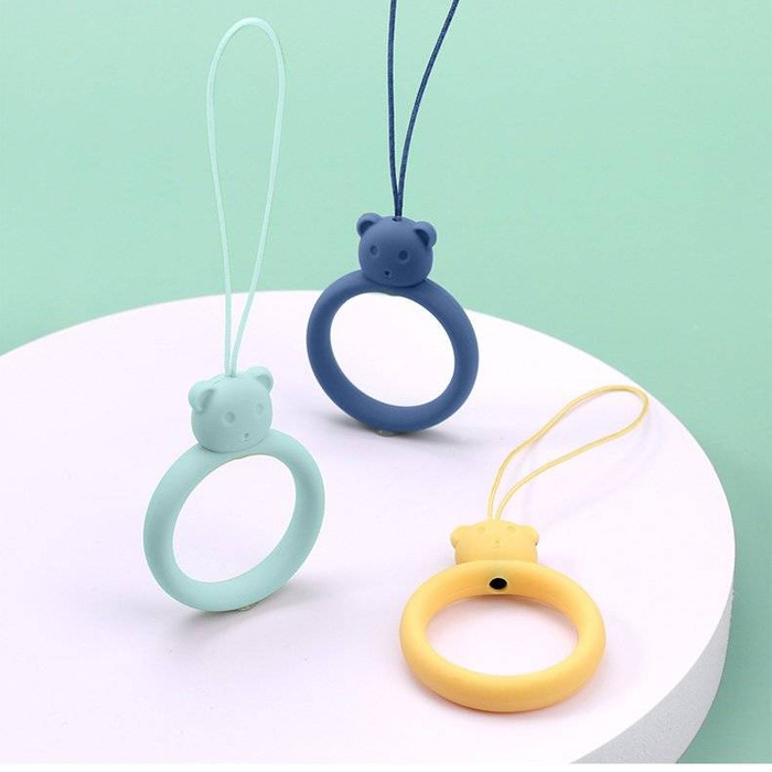 A silicone lanyard for a phone bear ring on a finger yellow